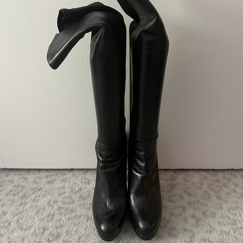 Over the knee 50/50 black high heel boots. Worn once. Size 8. Heel about 4.5 in
